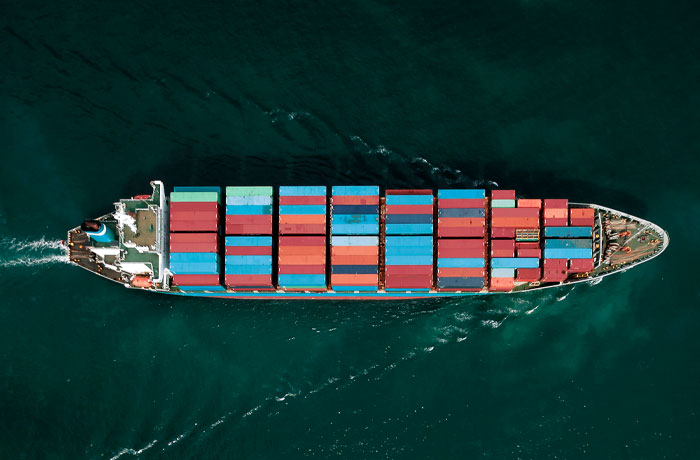aerial view of boat with shipping containers