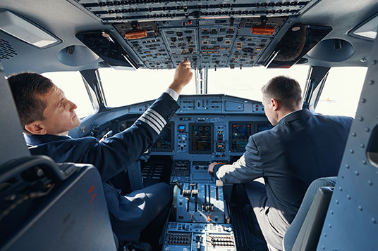 two pilots in an airplane