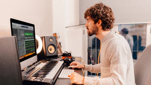 Man working on music editing